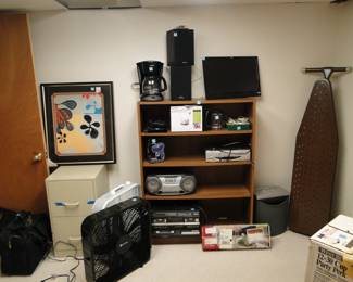 Electronics and bookcase, and ironing board too