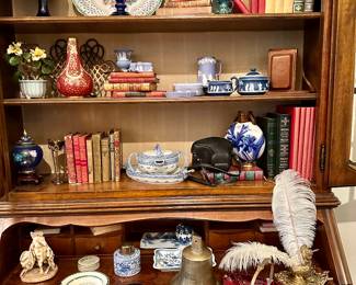 Feather pen and ink dip, Princess Diana collectibles, ship bell, antique piggy bank, bride bowl, vintage Kodak camera, digital camera, and more