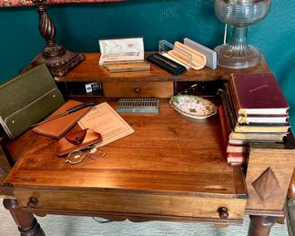 Antique writing desk, hurricane lamp, tapestry, and more