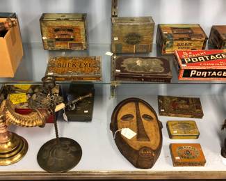 Antique tobacco tins, African mask, Chapman horn lamp