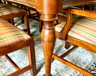 Dining room table with turned legs and fretwork - $650 - 74x45x30, 2 leaves at 18 inches each; Chippendale style dining armchairs with plaid cushion by Bassett (2 available) - $200 (each) - 24.5x19x41; Chippendale style dining side chair by Bassett with plaid cushion (8 available) - $100 (each) - 21.5x19.5x41 