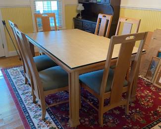 Like new, excellent condition solid white oak wood, This dining set from the American Revival Collection by Thomasville Furniture includes 6 chairs  Standing on square, column style legs, the table top features a gridded pattern of inlays. Each chair features flat, straight splats and upholstered seats 