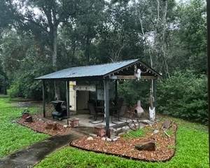 Outdoor cooking area.  The perfect pits, smokers, storage cabinets for sale.
