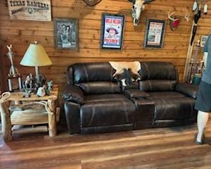 Pool Table Room: Couches, rustic wooden table, memorabilia 