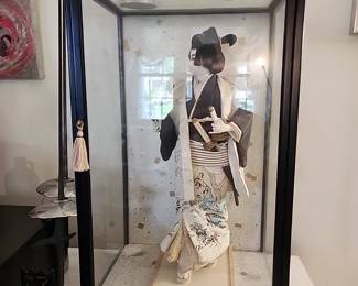 Oriental Geisha doll with swords in a nice display case
