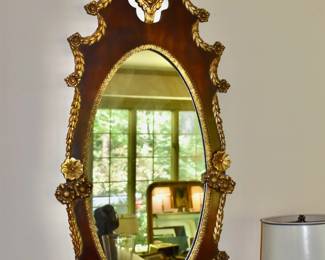 Mahogany and gilt mirror with cherub decoration