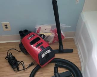 Like New Dirt Devil  Vacuum Cleaner .Very Light Weight  ( Includes New Bags And Belt) 