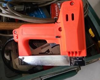 Upholstery kit with electric stapler, tools and manuals