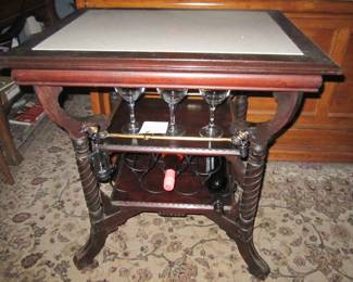Custom Bar with marble top, wine opener, and wine stopper included. Wine rack on bottom shelf.