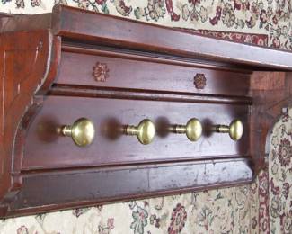 Custom made Coat Rack with brass door knob hangers.