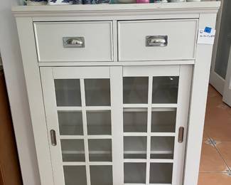 	#6	White Storage Cabinet w/2 drawers and 2 sliding doors.	36.5x17x47.5		100.00																							