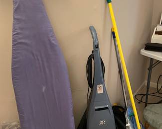 Ironing board upright vacuum