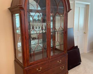 Tall American Drew Company china cabinet with lights that dim.  Matches the dining room table and side board.