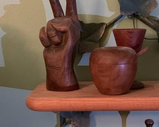 Carved wood peace sign and apple