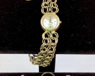 DILA221 Vintage 14k Gold Pieces, Bracelet, Earrings, Pendants Ring Omega "Ladymatic" Swiss made watch, working 14k center piece enclosure, 14k gold filled bracelet. Pair of earrings, 1 post is not original to the earrings & fits loosely. 10k heart shaped locket. 10k heart shaped pendant. Gold like small ring.