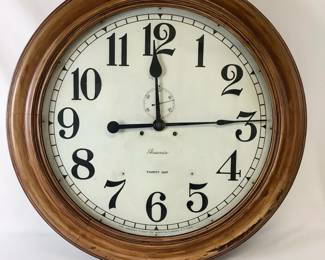 BIGA802 Vintage Train Station Wall Clock Large Ansonia Clock Company Thirty Day Wall Clock. Measuring approximately 24" in diameter, originally hung in a train station. Does not currently wind but does not appear to be completely put together.