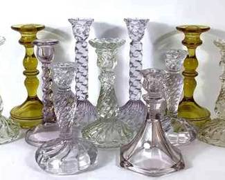 DILA213 Assortment Of Candlesticks Fostoria colony pattern with a slight lavender tint. Couple of amber color. McKee "Ray" c. 1910-1930 clear candlestick(3 of them).
