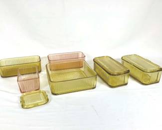 DILA705 Federal Glass Refrigerator Dished Set of translucent yellow Federal Glass refrigerator dishes. Includes one large dish without lid, four medium dishes, two with lids, one medium-small dish, and lid to one small dish.
