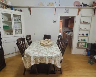 Bennington table with 4 chairs and cabinet with shelves.