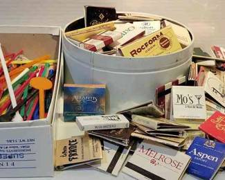 Assortment Of Matchbooks And Drink Stirrers