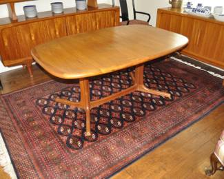 Mid Century Danish Dyrlund dining table.  42" wide x 64" long with two 20" leaves