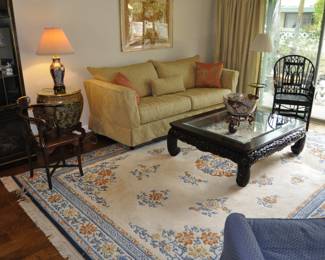 42" x 50" Asian themed glass top coffee table.