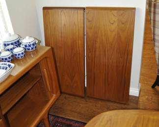 Mid Century Danish Dyrlund dining table.  42" wide x 64" long with two 20" leaves