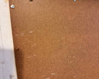 Screws affixing board to frame 