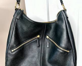 Close-up view of Vera Bradley, Black leather purse