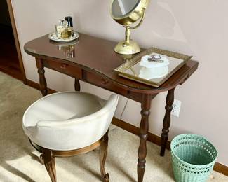 Vanity, swivel chair, wicker wastebasket, make-up mirror, Channel and RL perfume
