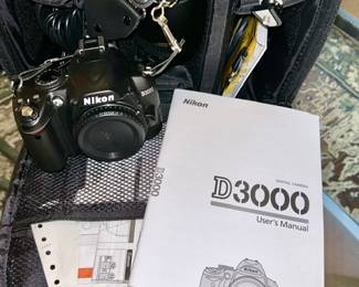 Nikon D3000 camera and accessories in large case