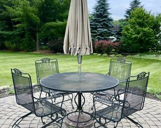 Metal patio table with umbrella and 4 matching chairs