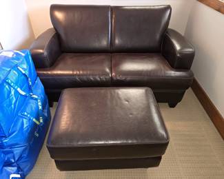 High Quality Leather Loveseat (82" x 38"d) with ottoman (30" x 22".) In excellent condition!