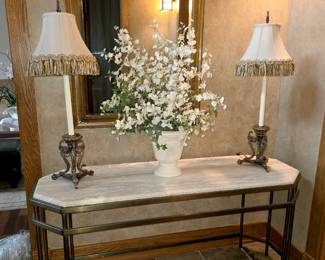 Mable top Entry Table. Base is a heavy metal. Frederik Cooper lamps. Beveled Wall Mirror with Leather Frame.