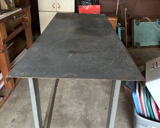 Metal work table on wheels