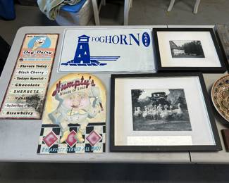 Decorative wall objects, like metal signs and photographs