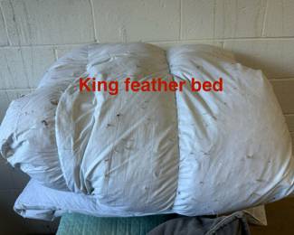 King featherbed. Super cozy but needs to be washed. 