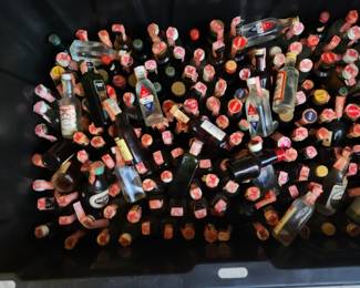 Hundreds of 1970's Glass one ounce bottles.