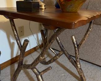 This is an unusual and cool occasional table. Sitting on top is a lovely art glass bowl from the Glass Eye Studio.