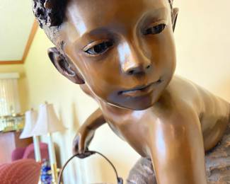 Detail of the face of the bronze boy.