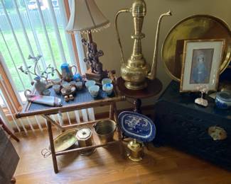 Asian inspired items. There is an elephant lamp in the background and some really lovely brass pieces.