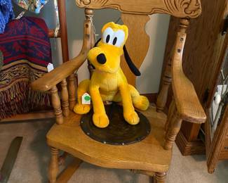 Another child's antique rocker. Pluto likes it.