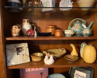Shelves full of art pottery and interesting goodies