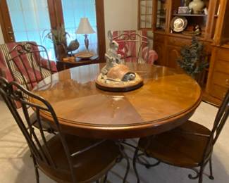 Sweet round oak glass topped table and 4 chairs.