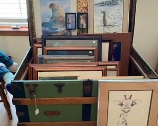 Antique trunk full of framed art...many animal pictures that were taken by the owner when on safari in Africa.