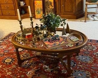 Oval glass topped coffee table in the downstairs area.