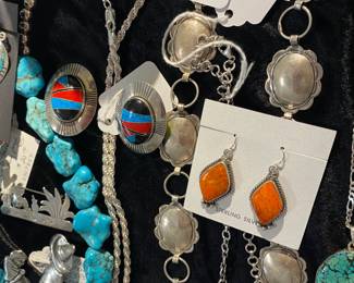 Spiny oyster and Zuni inlay earrings, along with sterling concho belt