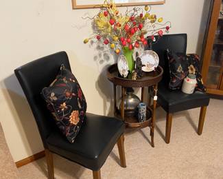 Pair of nice leather-look upholstered chairs with cute table in the middle that has a removeable tray.
