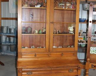 Antique circa 1870 carved hunting cabinet.