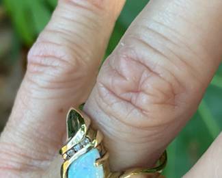 #91 - $325 - 14kt yellow gold ring with Opal and diamond 3.8 grams. sz 7.5 